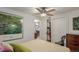 Relaxing bedroom features ceiling fan, closet, and coordinating neutral color scheme to create a comfortable living space at 6043 S Cody Way, Littleton, CO 80123