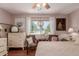 Bright bedroom with ceiling fan, large window, hardwood floors and plenty of natural light at 6043 S Cody Way, Littleton, CO 80123