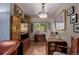 Cozy dining area with hardwood floors, a modern chandelier, and ample natural light at 6043 S Cody Way, Littleton, CO 80123