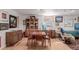 Formal dining room features wood floors, stylish hutch and a large window at 6043 S Cody Way, Littleton, CO 80123
