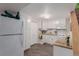 Updated kitchen with appliances and cabinets featuring plenty of storage space, as well as granite countertops at 6043 S Cody Way, Littleton, CO 80123