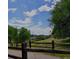 Picturesque view of rolling hills and a walking path framed by lush greenery and a clear blue sky at 6043 S Cody Way, Littleton, CO 80123