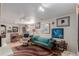 Inviting living room featuring a comfortable sofa, decorative art, and warm lighting, perfect for relaxation and entertainment at 6043 S Cody Way, Littleton, CO 80123