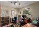 Home office with natural light, wooden floors, and neutral walls at 6043 S Cody Way, Littleton, CO 80123