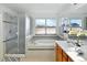 Bright bathroom features a soaking tub next to a glass-enclosed shower at 8645 Coors St, Arvada, CO 80005