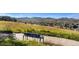 Scenic community view with a park and walking path, surrounded by homes and mountains at 8645 Coors St, Arvada, CO 80005