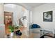 Bright foyer with a grand staircase, hardwood floors, and elegant decor at 8645 Coors St, Arvada, CO 80005