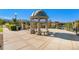 Open-air gazebo on platform overlooking neighborhood with mountain views under a bright blue sky at 8645 Coors St, Arvada, CO 80005