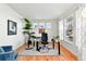 Bright office space featuring hardwood floors, large windows for natural light, and modern decor at 8645 Coors St, Arvada, CO 80005
