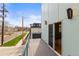 View of the street from the home's balcony with iron railing at 3220 W 20Th Ave # 1, Denver, CO 80211
