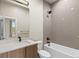 Bathroom featuring a shower-tub combo and single-sink vanity at 3220 W 20Th Ave # 1, Denver, CO 80211