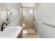 Bathroom featuring a glass-enclosed shower and a sink with modern black faucet at 3220 W 20Th Ave # 1, Denver, CO 80211