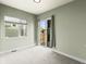 Bedroom with carpet, large window, and sliding door to balcony at 3220 W 20Th Ave # 1, Denver, CO 80211