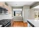 Modern kitchen featuring stainless appliances, light cabinets and hardwood floors at 3220 W 20Th Ave # 1, Denver, CO 80211