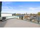 Spacious rooftop deck with sleek railings offers neighborhood views and a modern outdoor living space at 3220 W 20Th Ave # 1, Denver, CO 80211