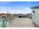 Stunning rooftop deck showcases city skyline and provides ample room for relaxing and entertaining with modern style at 3220 W 20Th Ave # 1, Denver, CO 80211