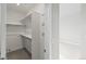 Walk-in closet features shelving for clothes and storage with hooks for accessories at 3220 W 20Th Ave # 1, Denver, CO 80211