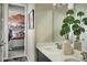Elegant bathroom with double sinks and a view of the bedroom at 16939 Black Rose Cir, Parker, CO 80134