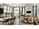 Open concept living area with kitchen island and fireplace at 16939 Black Rose Cir, Parker, CO 80134