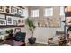 Bright home office featuring built-in shelves and a comfortable seating area at 16939 Black Rose Cir, Parker, CO 80134
