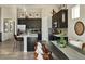 Modern kitchen with dark cabinetry, white countertops and island at 16939 Black Rose Cir, Parker, CO 80134