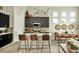 Modern kitchen with dark cabinets and an island at 16939 Black Rose Cir, Parker, CO 80134