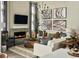 Spacious living room with fireplace and large sectional sofa at 16939 Black Rose Cir, Parker, CO 80134