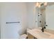 Modern bathroom featuring sleek fixtures, vanity, and tiled shower at 1875 Hickory Ave, Erie, CO 80516