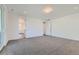 Spacious bedroom with neutral carpeting and bright white walls at 1875 Hickory Ave, Erie, CO 80516