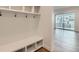 Functional entryway featuring built-in bench and storage at 1875 Hickory Ave, Erie, CO 80516