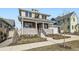 Charming two-story home with a cozy front porch, manicured landscaping, and an attached two car garage at 1875 Hickory Ave, Erie, CO 80516