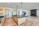 Spacious open-concept kitchen featuring an island, stainless steel appliances, and access to living space at 1875 Hickory Ave, Erie, CO 80516