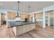 Modern kitchen featuring a large center island, stainless steel appliances, and stylish cabinetry at 1875 Hickory Ave, Erie, CO 80516