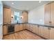 Stylish wet bar area with wood cabinets and beverage refrigerator at 1875 Hickory Ave, Erie, CO 80516