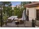 Beautiful deck with comfortable outdoor seating, a grill, and lush greenery, perfect for enjoying the outdoors at 858 Swandyke Dr, Castle Rock, CO 80108