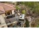 Stunning deck with an outdoor kitchen, a cozy fire pit, and a serene stream, perfect for entertaining and relaxation at 858 Swandyke Dr, Castle Rock, CO 80108