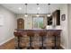 Finished basement with a stylish bar area, pendant lighting, and comfortable seating, ideal for entertaining at 858 Swandyke Dr, Castle Rock, CO 80108