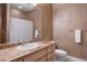 Cozy bathroom with a single sink vanity, warm lighting, and essential amenities, offering comfort and convenience at 858 Swandyke Dr, Castle Rock, CO 80108