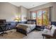 Cozy bedroom with a large window and plush carpeting, offering a peaceful retreat with natural light at 858 Swandyke Dr, Castle Rock, CO 80108