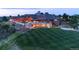 Stunning exterior view of the home with manicured lawn, showcasing its elegant architecture and beautiful setting at 858 Swandyke Dr, Castle Rock, CO 80108