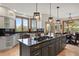 Gourmet kitchen with a large island, custom cabinetry, and modern appliances at 858 Swandyke Dr, Castle Rock, CO 80108