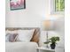 Comfortable bedroom featuring a patterned headboard, soft pillows, and natural light from the window at 6506 Lee St, Arvada, CO 80004