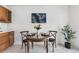Charming dining area with a round glass-top table, perfect for intimate meals and gatherings at 6506 Lee St, Arvada, CO 80004