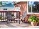 Inviting front porch with comfortable seating, perfect for relaxing and enjoying the outdoors at 6506 Lee St, Arvada, CO 80004
