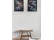 Stylish home decor featuring artistic paintings and a unique wooden bench, adding a touch of elegance at 6506 Lee St, Arvada, CO 80004