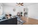 This bright living room features hardwood floors that flow into the dining room at 6506 Lee St, Arvada, CO 80004