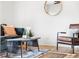Cozy living room featuring stylish furniture, a decorative rug, and a well-lit space at 6506 Lee St, Arvada, CO 80004