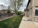 Large backyard with a well-kept lawn and privacy fence, ideal for outdoor activities and relaxation at 13031 Dexter St, Thornton, CO 80241
