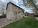 A spacious backyard with a well-maintained lawn and a brick patio at 13031 Dexter St, Thornton, CO 80241