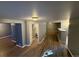 Full view of partially finished basement, great for storage or renovation at 13031 Dexter St, Thornton, CO 80241